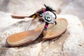 Summer sandals on a sandy beach Royalty Free Stock Photo