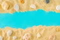 Summer sandy beach concept with rocks on blue background. Summer abstract tropic art with copy space Royalty Free Stock Photo