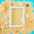 Summer sandy beach concept with rocks on blue background. Summer abstract tropic art with frame Royalty Free Stock Photo