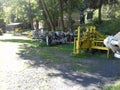 Summer scene: Landek open air exposition with multiple coal mine machines.