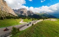 Summer scenery of Dolomiti with rugged Sella Mountains under blue sunny sky in background