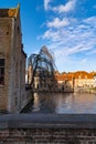 Summer scenery with Gothic style houses of Sint-Janshospitaal and water canal in medieval Belgian city from Flanders