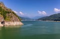 Summer scenery of Vidraru Dam and lake glowing in sunlight. Vidraru Dam, Romania. Carpathian Mountains, Fagaras ridge. Royalty Free Stock Photo