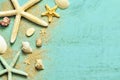 Summer sea background. Starfish, seashells and sand on a wooden blue background Royalty Free Stock Photo