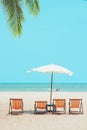 Summer sea beach empty chair umbrella with blue ocean sky for travel nature background vertical shot Royalty Free Stock Photo