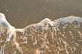 Summer sea, foam of undertow on a beach Royalty Free Stock Photo