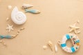 Summer sea concept. Ammonite, starfishes,snail shell and lifebuoy on sand. Top view. Copy space Royalty Free Stock Photo