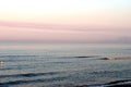 Summer sea, early morning on the beach, romantic pink sunrise Royalty Free Stock Photo