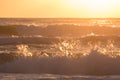 Summer sea surf splashing wave with sunlight