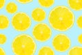 Summer seamless pattern. Lemon slices on a light blue background. Royalty Free Stock Photo