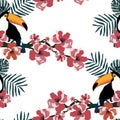 Tropical seamless pattern with cute birds,leafs and flowers.Summer vector background with toucans.Textile texture