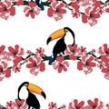 Colorful tropical seamless pattern with funny toucans and flowers.Summer vector background.Graphic textile texture
