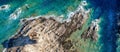 Summer seascape. Ancient tower with turquoise sea water, waves and rocks from top view, sardinia in Italy Royalty Free Stock Photo