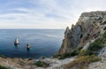 Summer seascape with Fiolent rocks formation on the coast of Sevastopol. view on cape in the sea, clear azure water, calm hot day