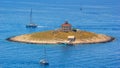 Summer seascape - view of the islet of Pokonji Dol with a old lighthouse, near the island of Hvar