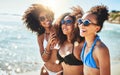 Summer, the season best spent with friends. a group of happy young women having fun together at the beach. Royalty Free Stock Photo