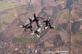 Group skydiving. Team jump. Four skydivers. Royalty Free Stock Photo