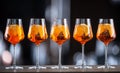 Summer sekt drink aperol spritz served in wine glasses with aperol, prosecco, soda and a slice of orange