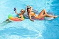 Summer sensual girls in pool. Summertime swimming pool. Summer leisure and holiday. Woman on summer vacation. Girl in