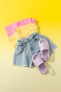 Summer set of clothes for girls and women. Denim shorts with colored T-shirts. Look for a summer vacation.