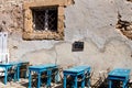 Summer Sicilian restaurant with blue tables