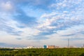 summer sky with blue clouds over forest and city Royalty Free Stock Photo