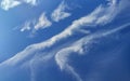 Summer sky landscape with beautiful feathery clouds on bright blue firmament