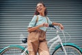 Summer, smile and girl with bicycle in city to explore, journey and outdoor adventure. Fashion, beauty and happy young Royalty Free Stock Photo