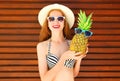 Summer smiling woman with funny pineapple in sunglasses Royalty Free Stock Photo