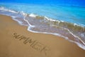 Summer spell written word in sand of a beach Royalty Free Stock Photo