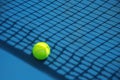 Summer sport concept with tennis ball and net on hard tennis court Royalty Free Stock Photo