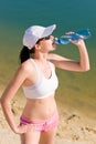 Summer sport fit woman drink water bottle Royalty Free Stock Photo