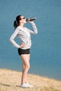 Summer sport fit woman drink water bottle Royalty Free Stock Photo