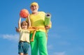 Summer sport and fun lifestyle. Sports education. Grandpa and grandson spotting. Father and child training together. I Royalty Free Stock Photo