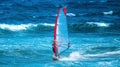 Windsurfer riding the wave during the summer Royalty Free Stock Photo