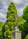 Statue of the Flora.Green park with road, path to bamboo trees alley. Nice and comfortable great garden. Beauty nature landscape. Royalty Free Stock Photo