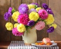 Summer still life in rustic style with flowers and fruits