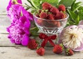 Summer still life with strawberries and flowers Royalty Free Stock Photo