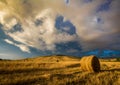 Summer storm approaches over harvested hay field in Tuscany, Italy Royalty Free Stock Photo