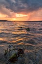 Summer storm on the lake in a beautiful sunset Royalty Free Stock Photo