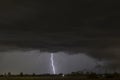 A summer storm with large lightnings over the Tuscan countryside of Bientina, Pisa, Italy Royalty Free Stock Photo