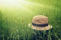 Summer straw hat on harvest paddy field, relaxing time