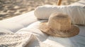 Summer straw hat on a sun lounger on a sandy beach. Royalty Free Stock Photo