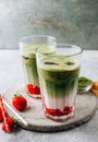 Summer strawberry matcha latte with ice in a glass cup Royalty Free Stock Photo