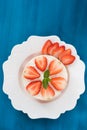 Summer strawberry mousse cake with fresh berries on the wooden blue background top view Royalty Free Stock Photo