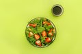 Summer Strawberry Salad with spinach leaves, arugula, walnuts and balsamic vinegar and olive oil dressing on avocado green Royalty Free Stock Photo