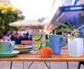 Summer street cafe glass of lemon orange water ,cup of coffee and flowers on wooden table in Tallinn old town vacation travel hol Royalty Free Stock Photo