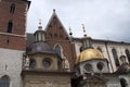 View of the rooftop domes and ornamentation along the side of Wawel Cathedral