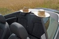 Summer, Sun, Car with two straw hats Royalty Free Stock Photo