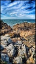Summer Sun over Brittany& x27;s Rocky Coastline - Plougrescant Seascape Royalty Free Stock Photo